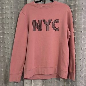 Pink NYC sweatshirt.